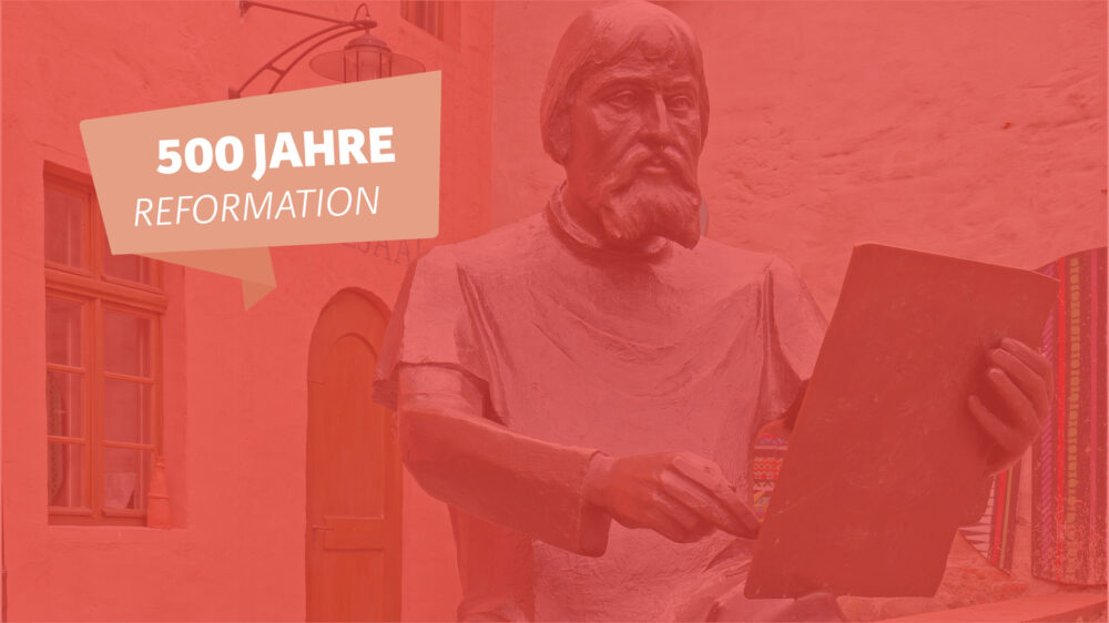 Lucas Cranach als Skulptur vor seiner Werkstatt in Wittenberg