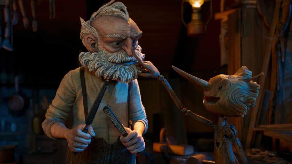 Holzschnitzer Geppetto mit seiner Holzpuppe Pinnochio